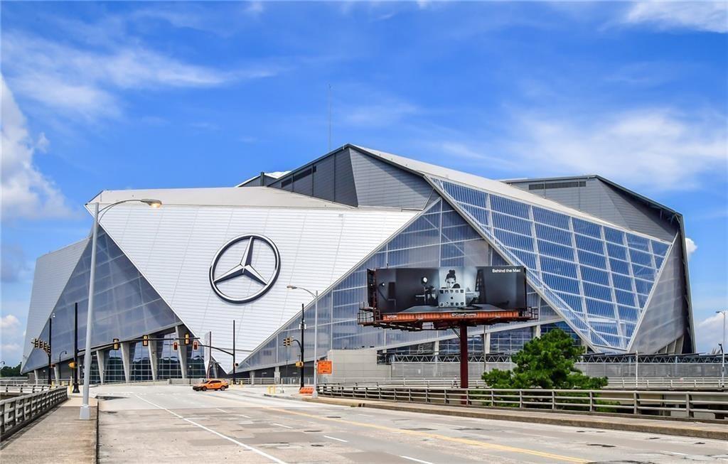 89 Mangum Street Southwest, Unit 207 Atlanta, GA 30313 - Photo 16 of 23 a front view of a house with a yard
