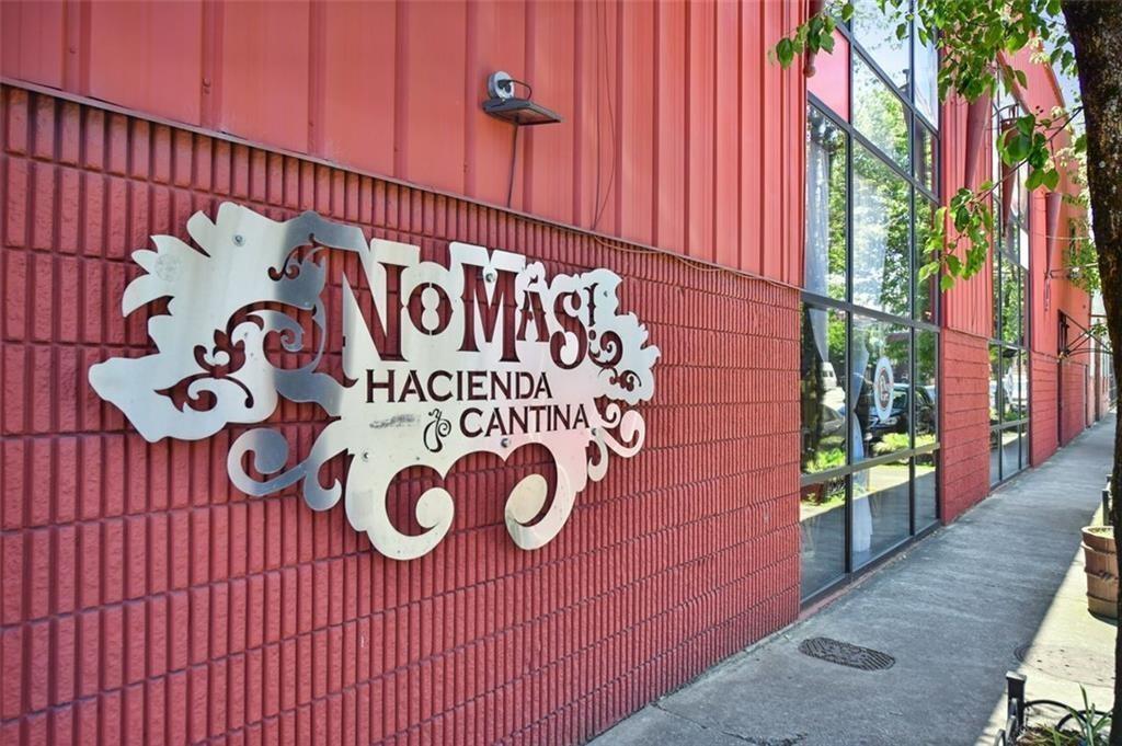 89 Mangum Street Southwest, Unit 207 Atlanta, GA 30313 - Photo 18 of 23 a sign board with wooden fence