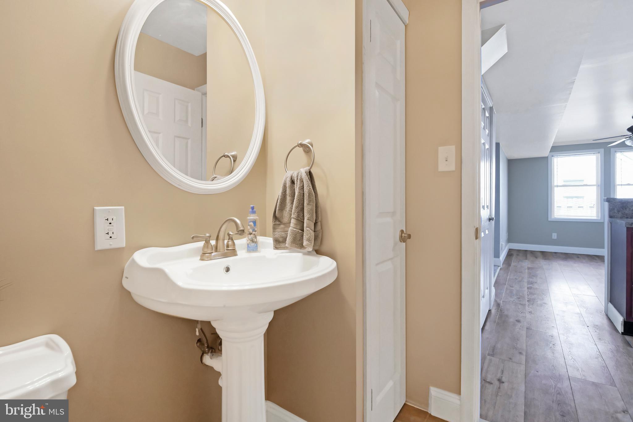 8104 Murray Point Road Dundalk, MD 21222 - Photo 16 of 44 Powder Rm w/ Pedestal Sink off the Kitchen