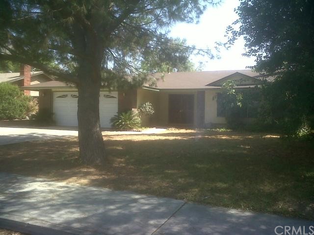 140 West Shady Grove Drive Riverside, CA 92507 - Photo 1 of 1 Front View of House and Pine Tree