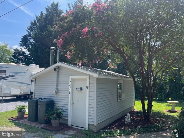 a bathroom with a sink vanity granite tub and shower