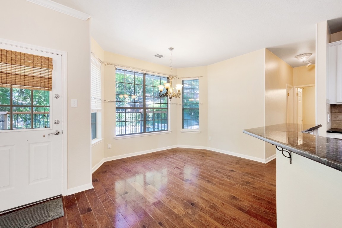 30103 Wingfoot Cove Georgetown, TX 78628 - Photo 12 of 38 a view of empty room with wooden floor and fan