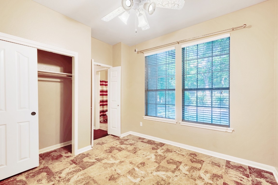 30103 Wingfoot Cove Georgetown, TX 78628 - Photo 19 of 38 a view of an empty room with window and bathroom