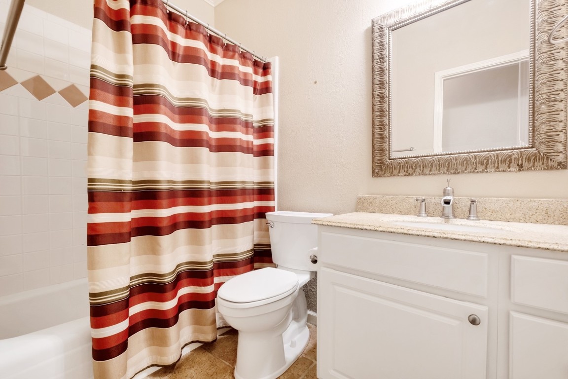 30103 Wingfoot Cove Georgetown, TX 78628 - Photo 20 of 38 a bathroom with a sink toilet and shower