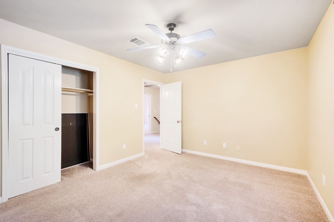 30103 Wingfoot Cove Georgetown, TX 78628 - Photo 27 of 38 a view of an empty room with a ceiling fan