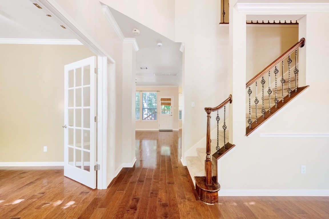 30103 Wingfoot Cove Georgetown, TX 78628 - Photo 4 of 38 a view of entryway with wooden floor and stairs