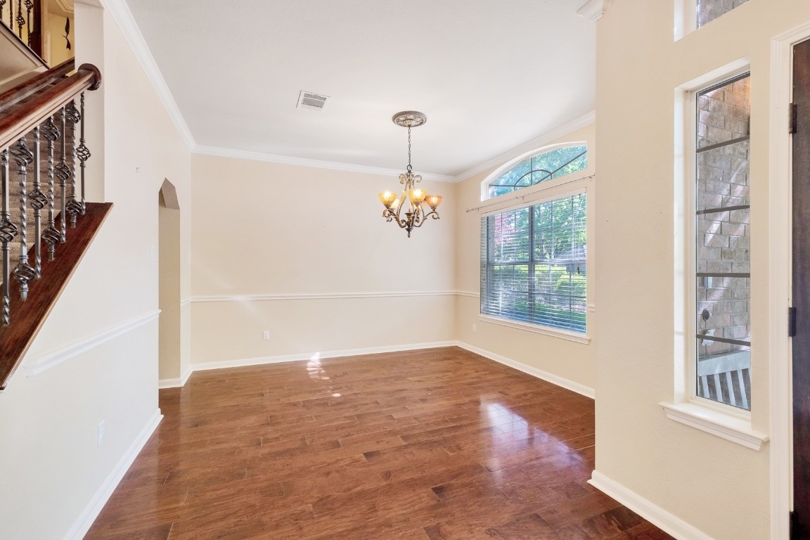 30103 Wingfoot Cove Georgetown, TX 78628 - Photo 5 of 38 a view of a livingroom with wooden floor and a ceiling fan