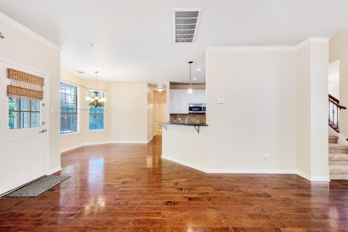 30103 Wingfoot Cove Georgetown, TX 78628 - Photo 10 of 38 a view of kitchen and hall with wooden floor