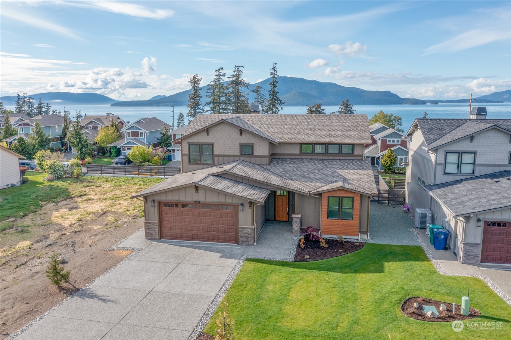 3908 West 3rd Street Anacortes, WA 98221 - Photo 2 of 39 a view of a house with a yard porch and sitting area