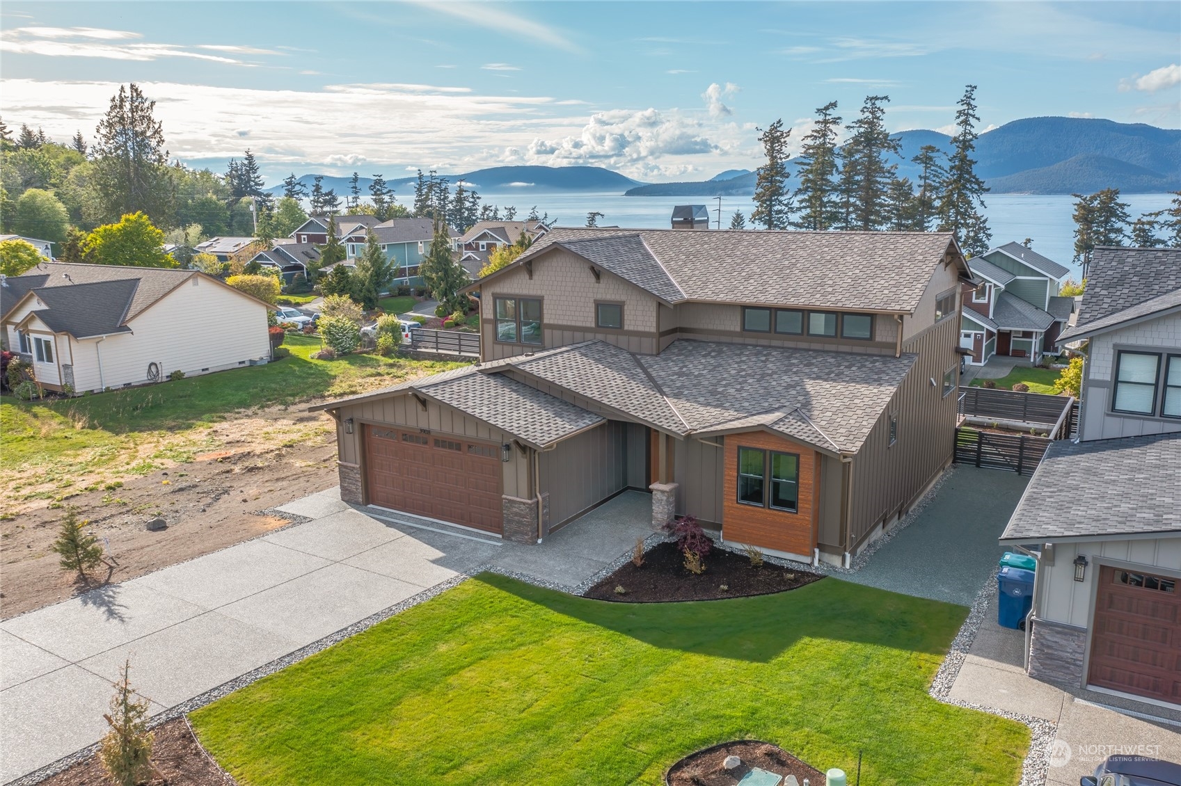 3908 West 3rd Street Anacortes, WA 98221 - Photo 3 of 39 a view of a house with a yard from a terrace