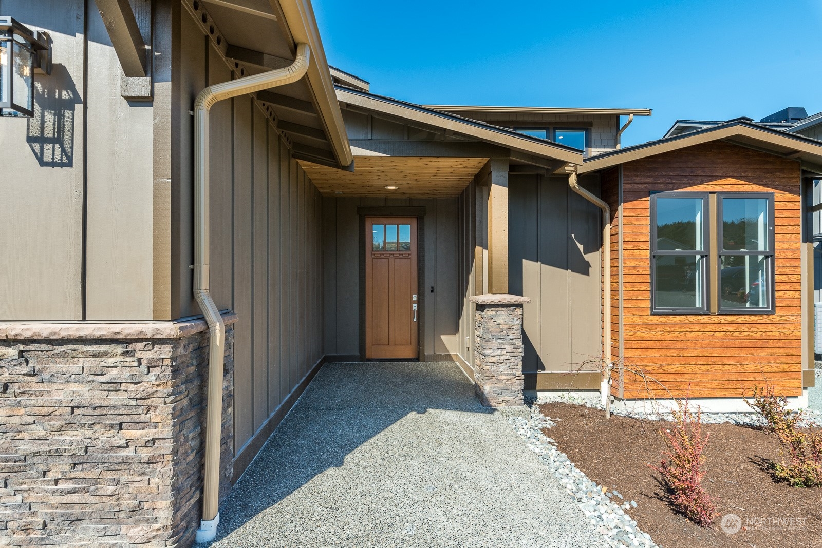 3908 West 3rd Street Anacortes, WA 98221 - Photo 5 of 39 a view of a house with wooden walls and stairs