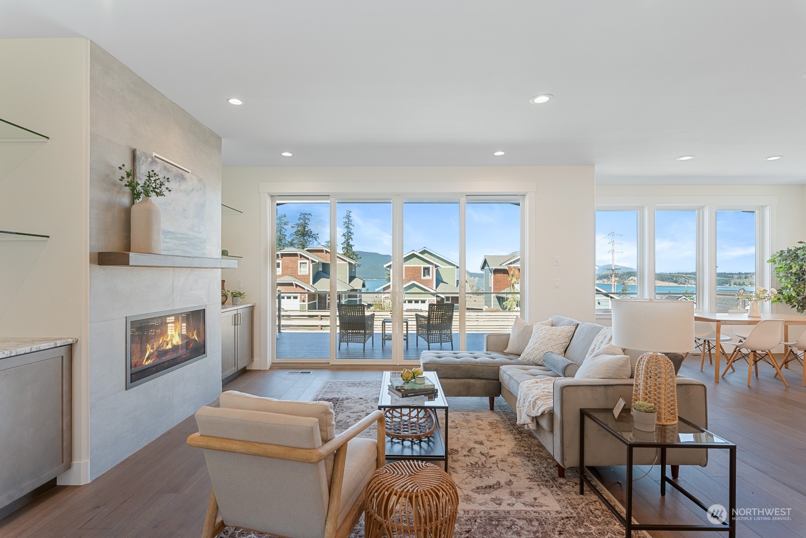 3908 West 3rd Street Anacortes, WA 98221 - Photo 8 of 39 a living room with fireplace furniture and a large window