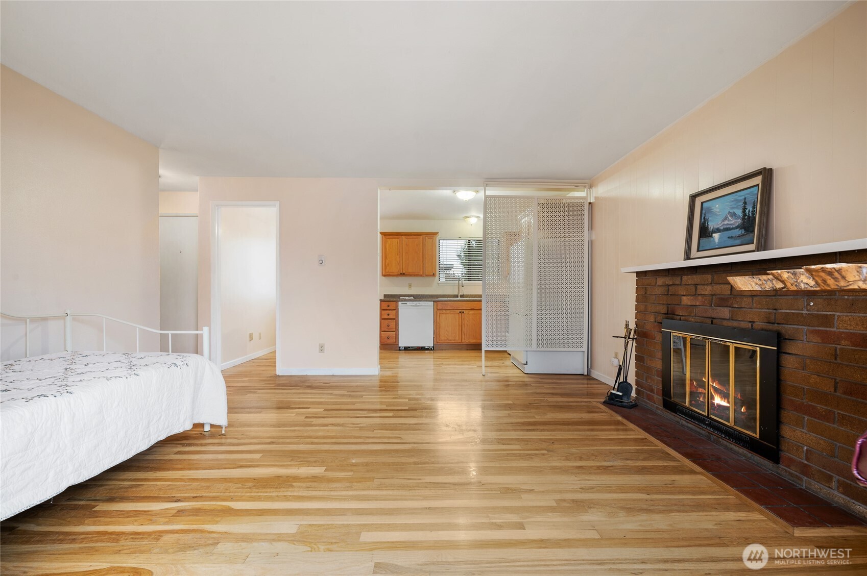 2014 Southwest 152nd Street Burien, WA 98166 - Photo 13 of 28 a view of a livingroom with wooden floor and a fireplace