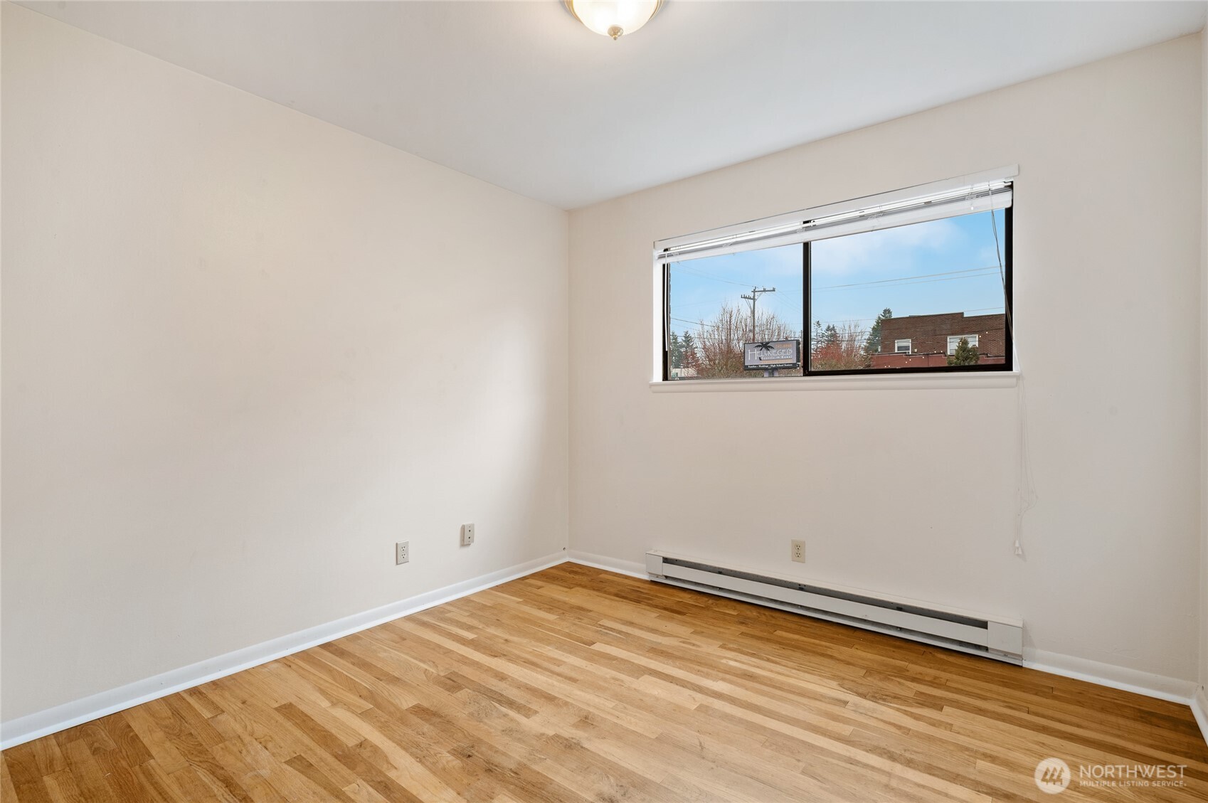 2014 Southwest 152nd Street Burien, WA 98166 - Photo 18 of 28 a view of a room with wooden floor and a window