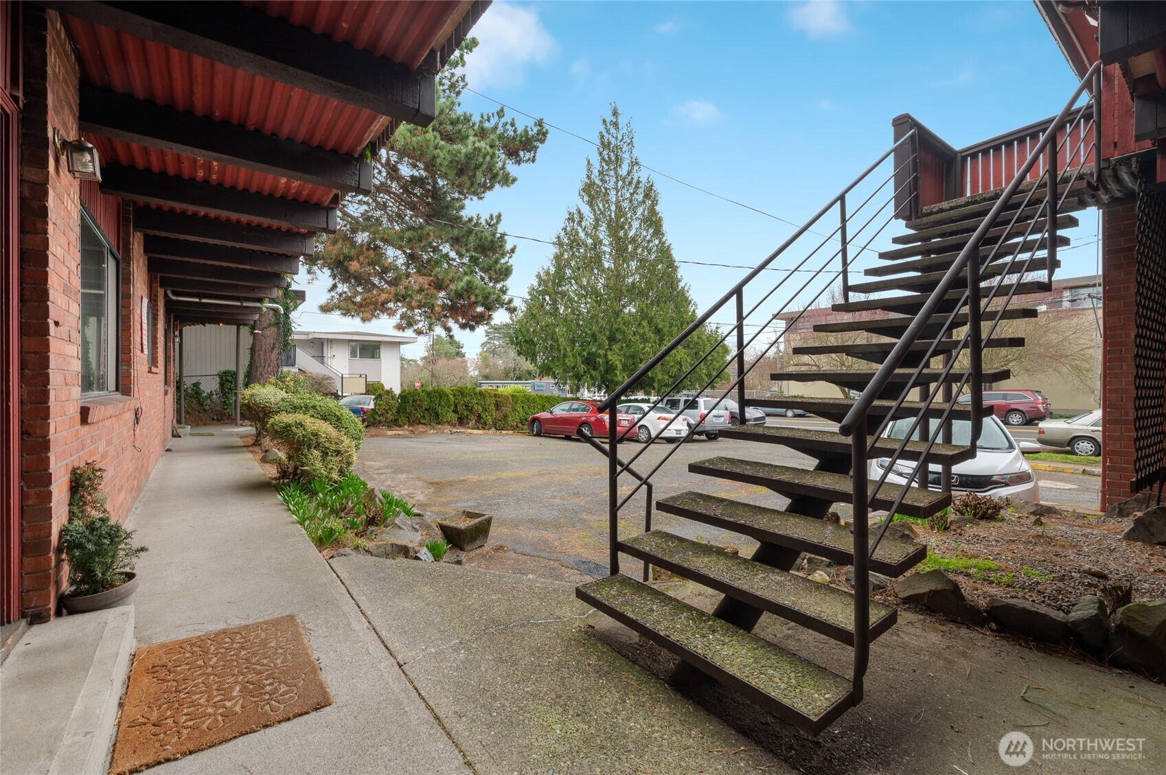 2014 Southwest 152nd Street Burien, WA 98166 - Photo 23 of 28 a view of a patio with table and chairs and potted plants with wooden floor and fence