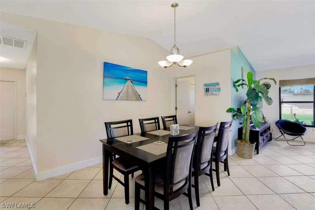 18507 Evergreen Road Fort Myers, FL 33967 - Photo 14 of 33 a view of a dining room with furniture and chandelier