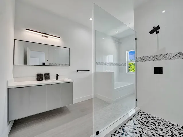 a bathroom with a sink and mirror