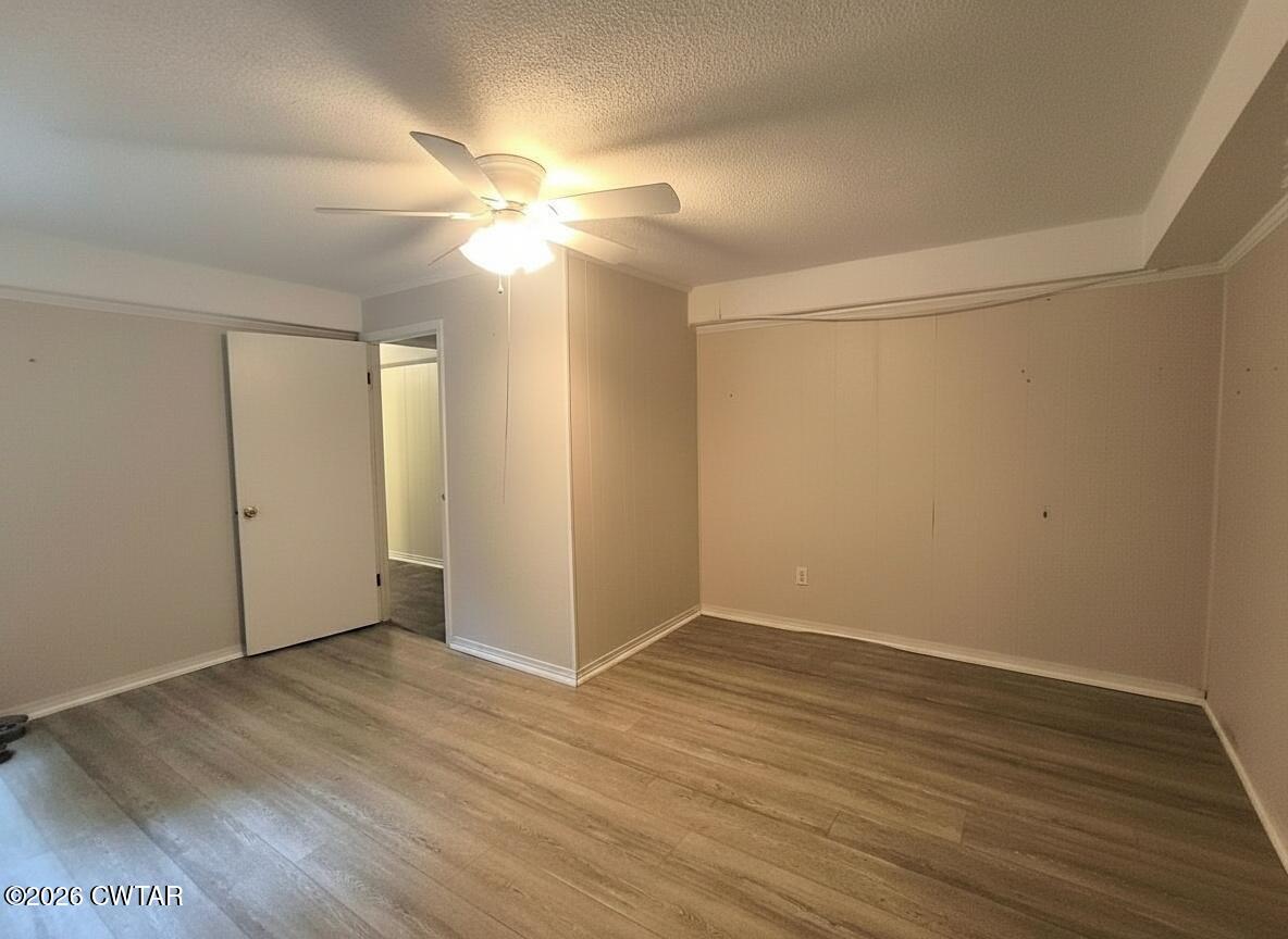 513 Viar Road Dyersburg, TN 38024 - Photo 36 of 37 a view of an empty room with wooden floor