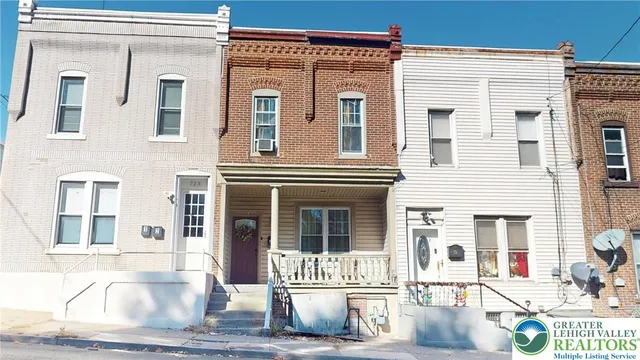 a front view of a building with street view