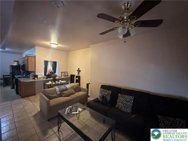 a kitchen that has a sink and a stove in it