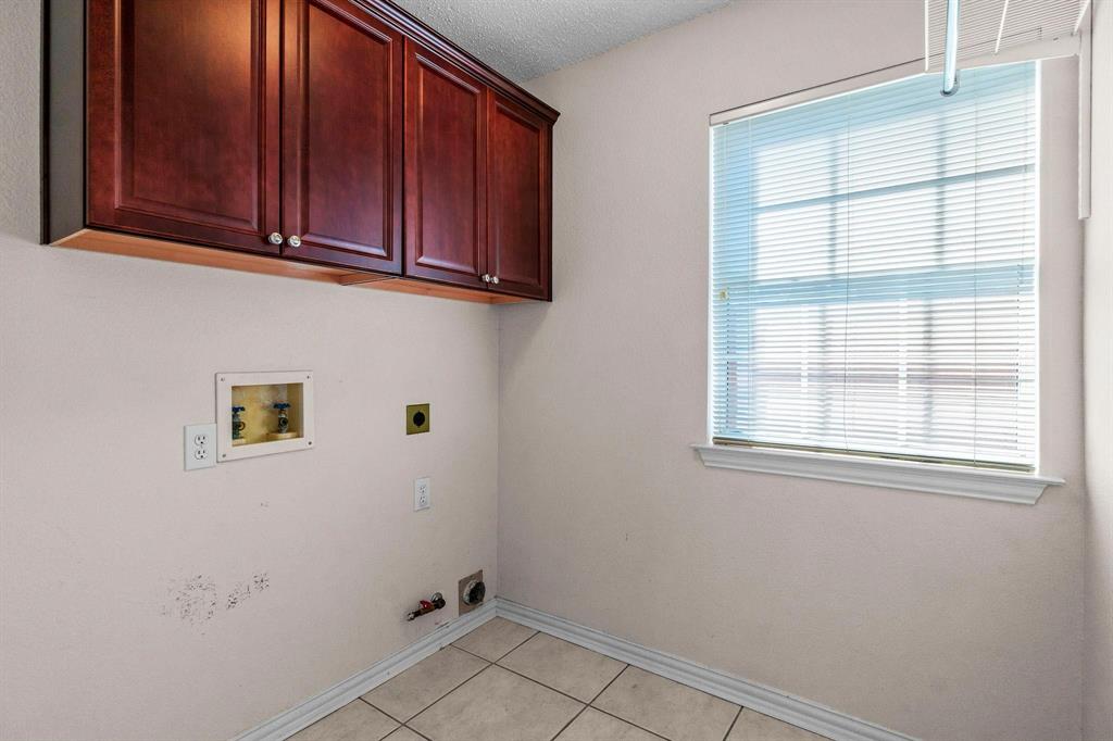 14588 Poe Court Addison, TX 75001 - Photo 26 of 28 a view of a storage and utility room