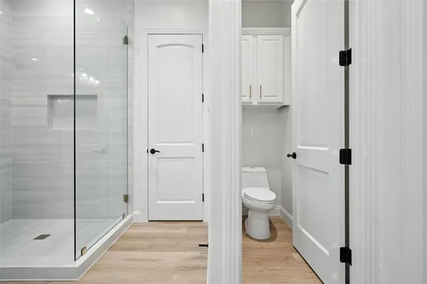 a hallway with a kitchen view and living room view
