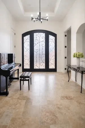 a view of a livingroom with furniture and a piano