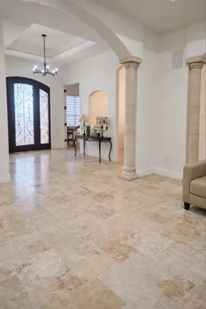 a modern kitchen with stainless steel appliances granite countertop a sink a stove and a refrigerator
