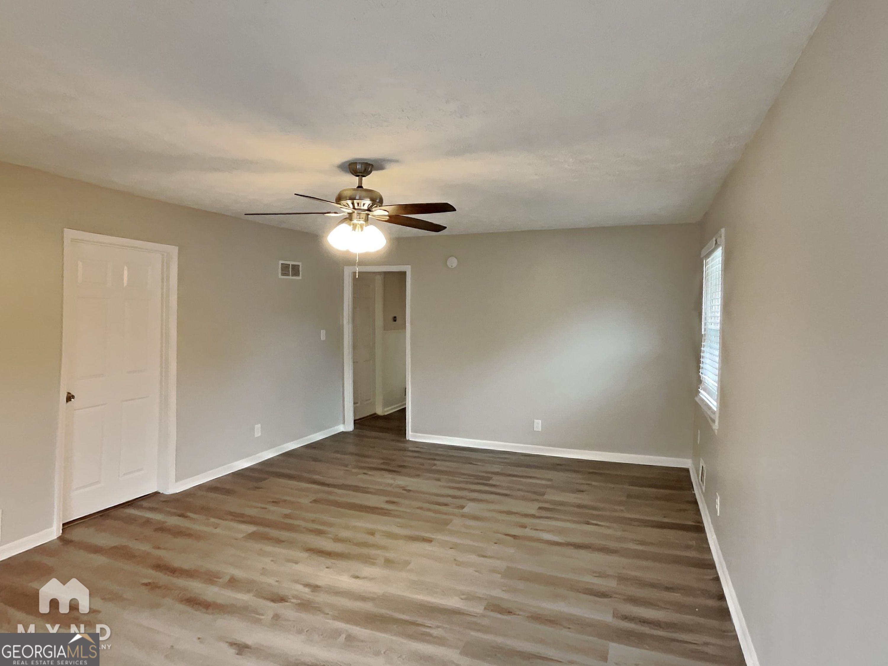 3821 Rex Circle Rex, GA 30273 - Photo 5 of 16 a view of an empty room with wooden floor
