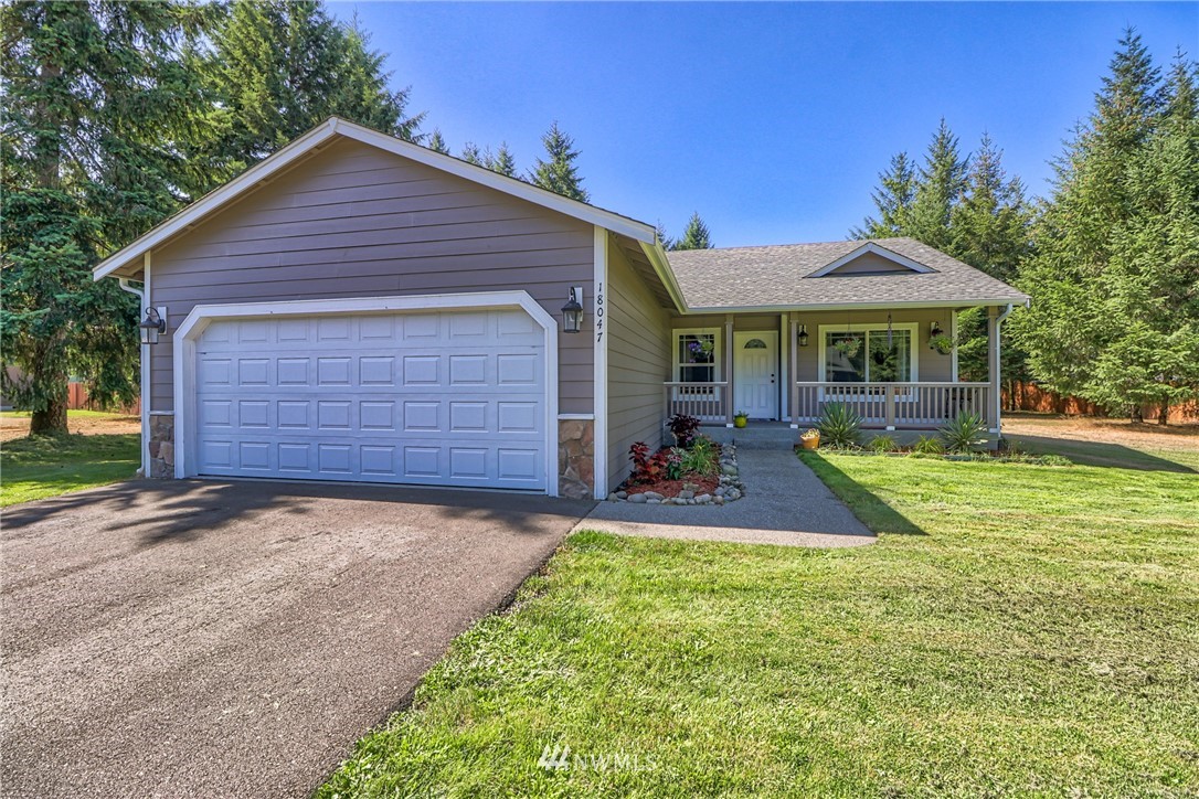 18047 Prairie Pointe Lane Southwest Rochester, WA 98579 - Photo 2 of 25 front view of a house with a yard