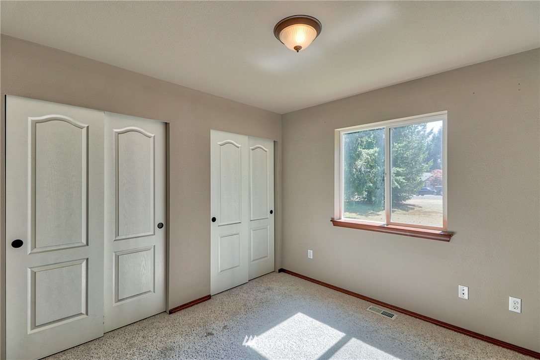 18047 Prairie Pointe Lane Southwest Rochester, WA 98579 - Photo 17 of 25 an empty room with windows