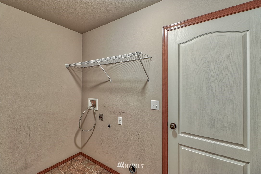 18047 Prairie Pointe Lane Southwest Rochester, WA 98579 - Photo 20 of 25 a bathroom with a glass shower door and mirror