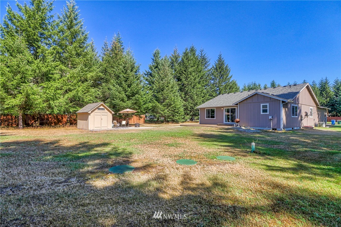 18047 Prairie Pointe Lane Southwest Rochester, WA 98579 - Photo 22 of 25 a view of a house with a yard