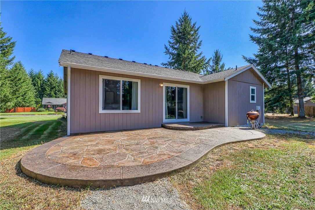 18047 Prairie Pointe Lane Southwest Rochester, WA 98579 - Photo 24 of 25 a view of a house with a backyard