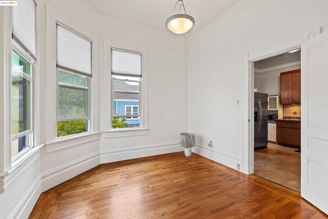 a bathroom with a granite countertop tub sink and mirror