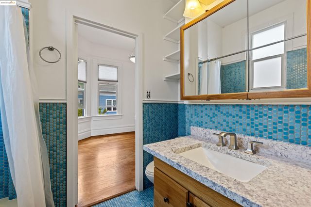 a room with a dresser and a wooden floor