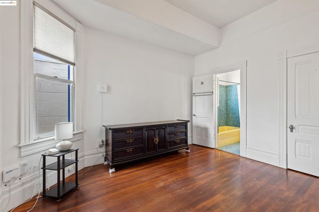 a view of a utility room with a door and a window