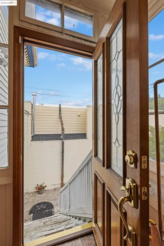 a view of street along with house and trees