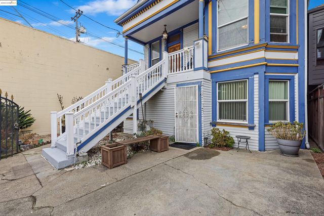 a house with potted plants in front of door