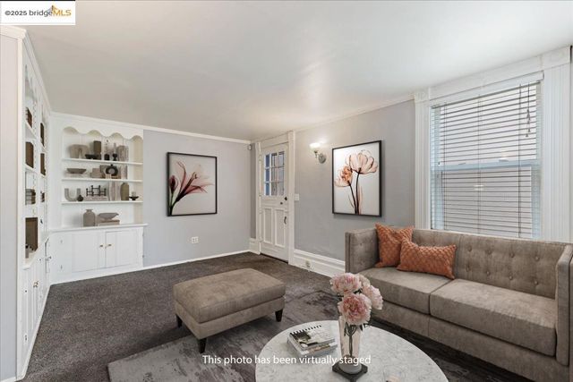 a living room with furniture and flat screen tv