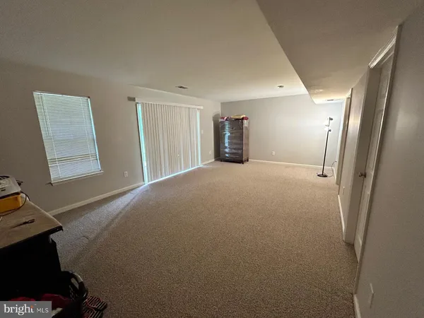 a big room with closet and windows