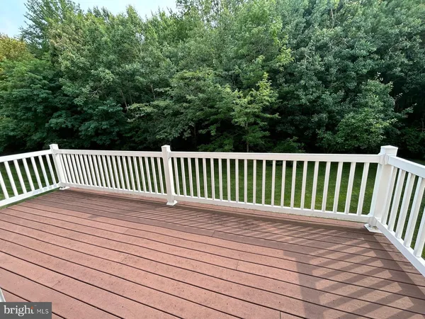 a view of deck with wooden floor and fence