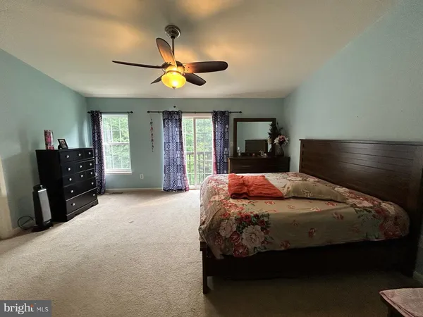 a bedroom with a bed and a closet