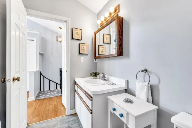 a bathroom with a sink and a mirror