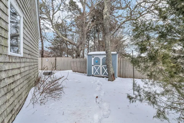 a view of a house with a snow in the yard