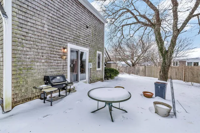 a view of a backyard with table and chairs