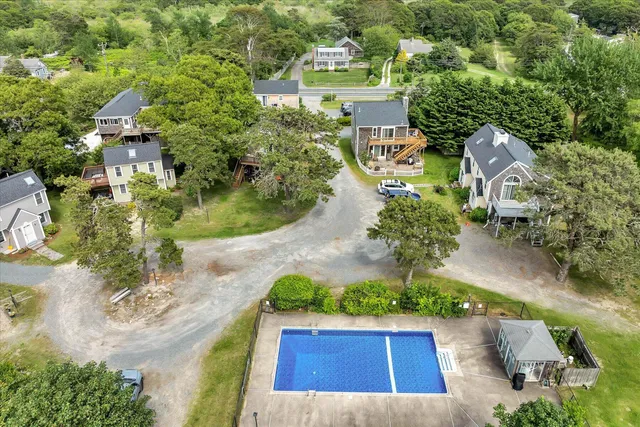 an aerial view of residential houses with outdoor space