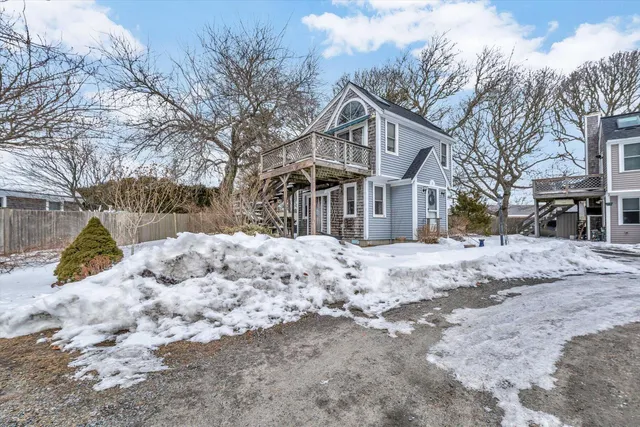 a view of a yard covered with snow