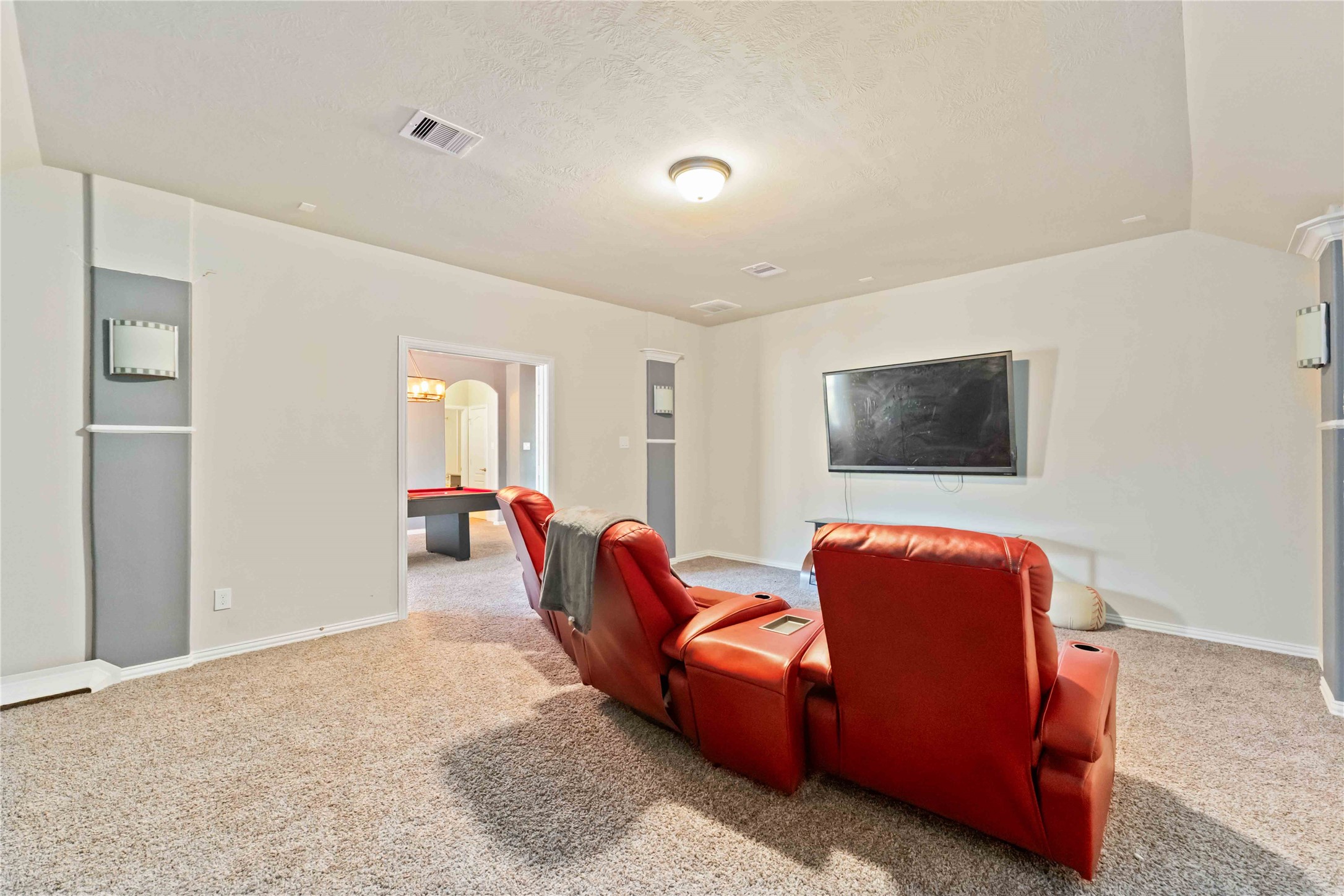 7403 Dry Stone Lane Rosenberg, TX 77469 - Photo 17 of 19 Spacious and private, your pre wired media room is the perfect place to settle in and enjoy your favorite entertainment.