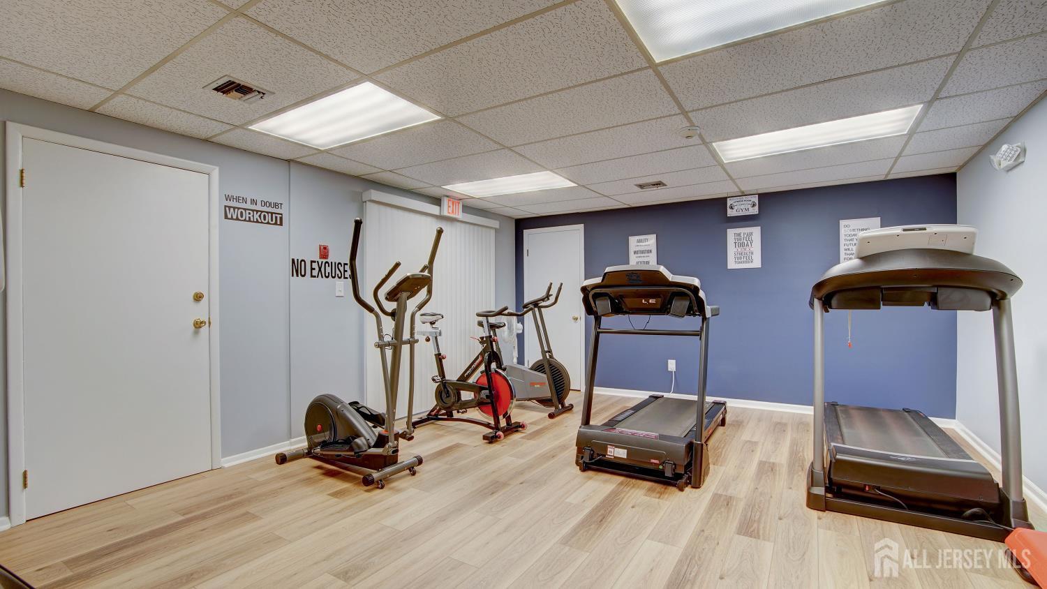86 Arrowood Road, Unit G Manalapan, NJ 07726 - Photo 14 of 16 a view of a room with gym equipment